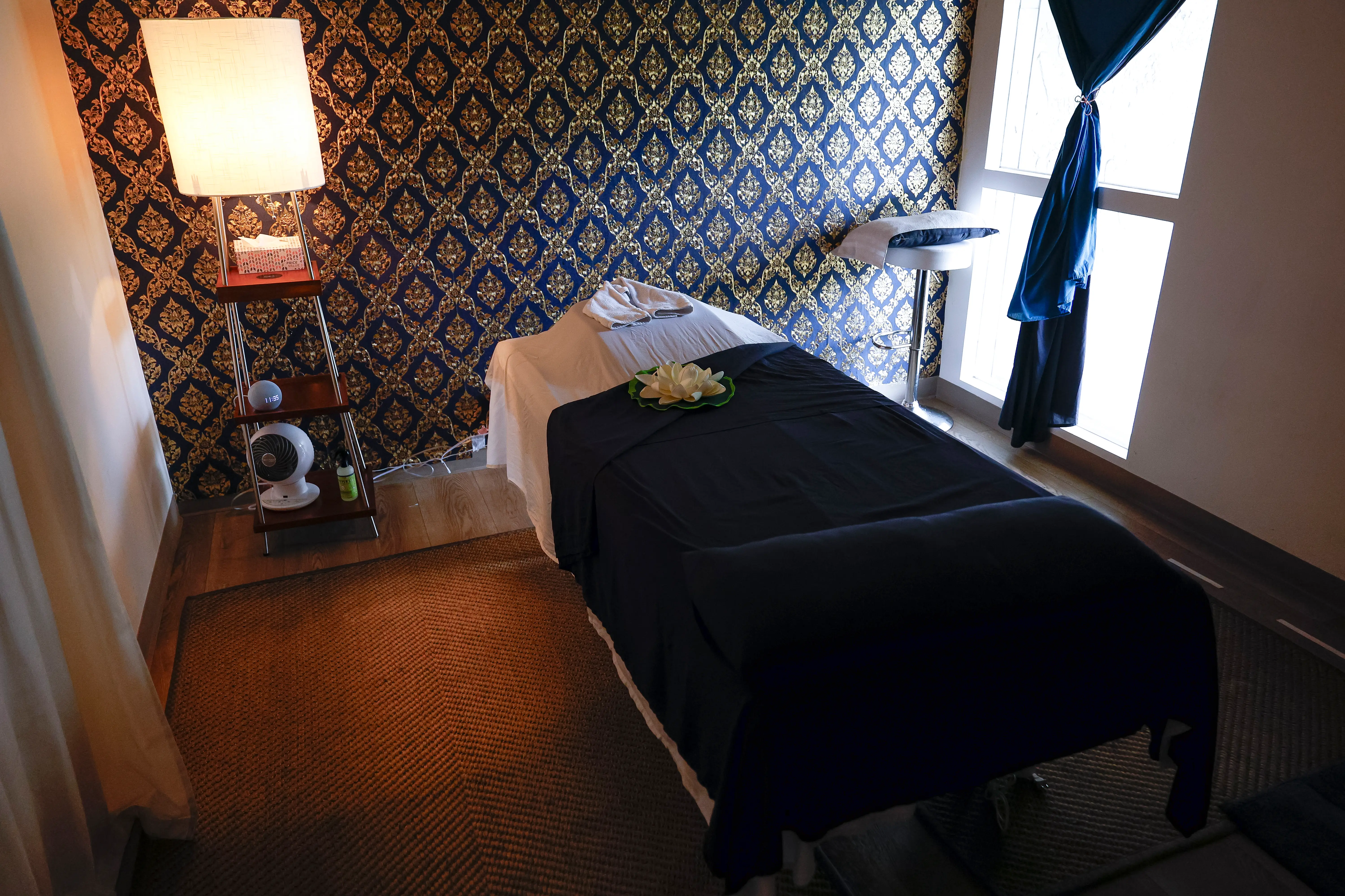 Massage room prepared with fresh linens