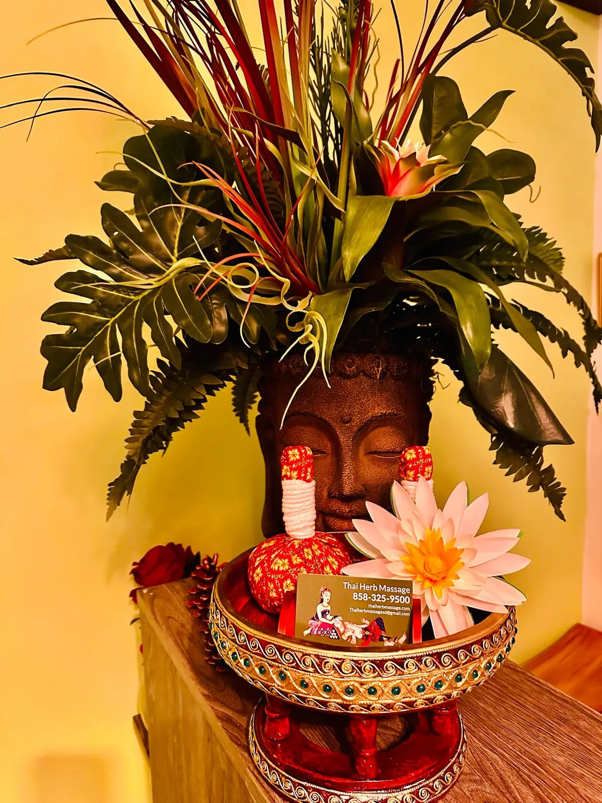 Thai Herb Massage spa entrance with traditional Thai statue